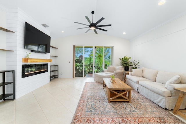 living area with light tile patterned flooring, a fireplace, lofted ceiling, visible vents, and ceiling fan