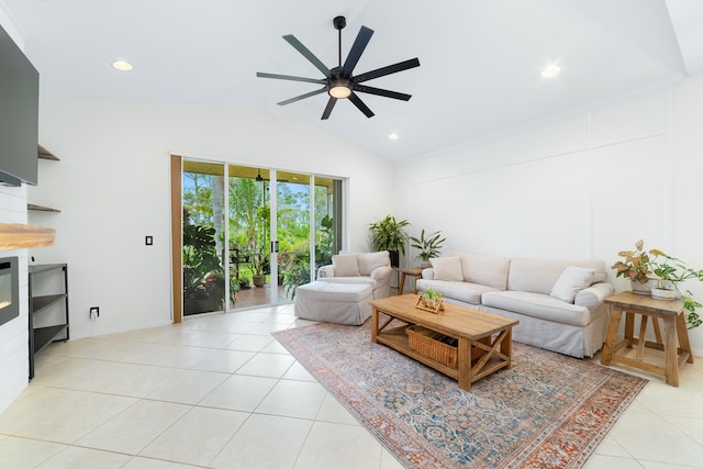 living area featuring a ceiling fan, a glass covered fireplace, lofted ceiling, light tile patterned floors, and recessed lighting