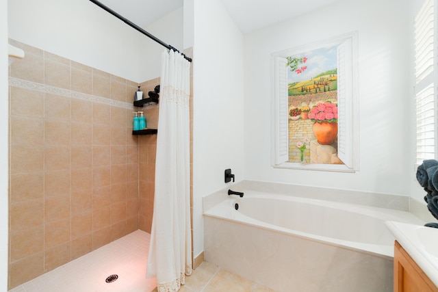 bathroom featuring a bath, a stall shower, tile patterned flooring, and vanity