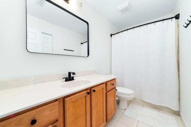 bathroom with tile patterned floors, a shower with shower curtain, toilet, and vanity