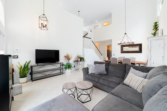 living area with arched walkways, stairs, a chandelier, and light tile patterned floors