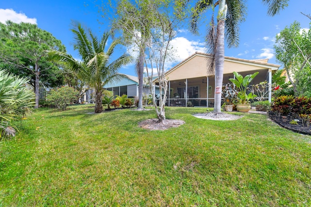 view of yard featuring a sunroom