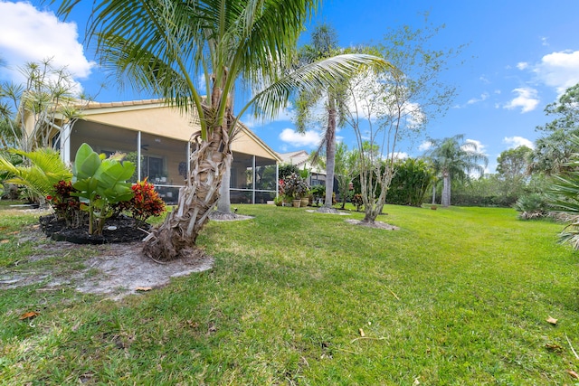 view of yard featuring a sunroom