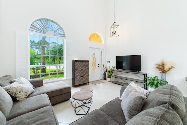 living room featuring light tile patterned flooring and a towering ceiling