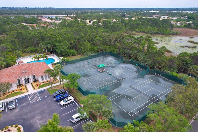 drone / aerial view featuring a wooded view