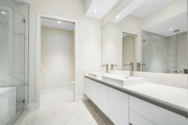 full bath with marble finish floor, a sink, and a marble finish shower
