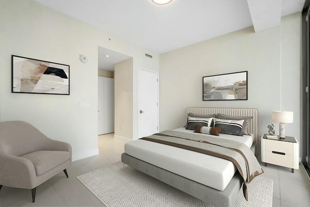 bedroom featuring baseboards and visible vents