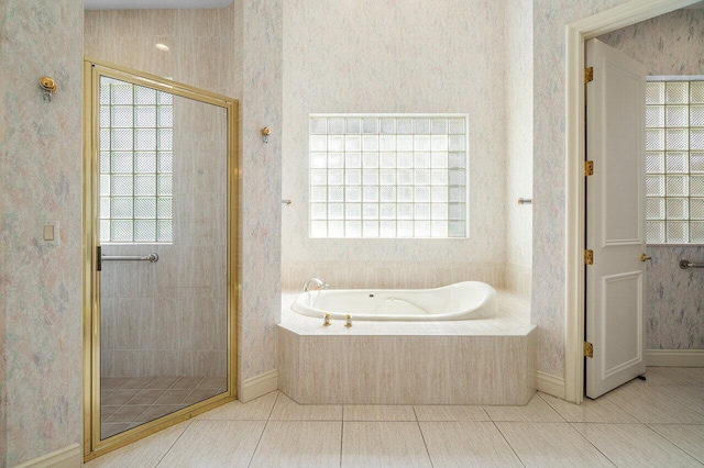 full bath featuring a garden tub, wallpapered walls, a stall shower, and tile patterned floors