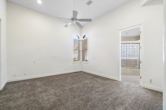carpeted spare room featuring visible vents, baseboards, ceiling fan, recessed lighting, and lofted ceiling