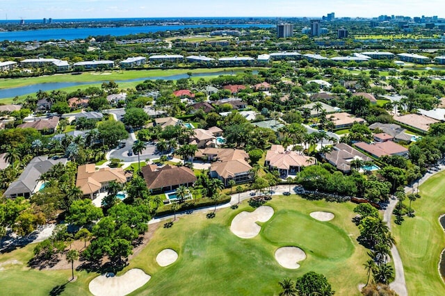 birds eye view of property with a water view, a residential view, and golf course view