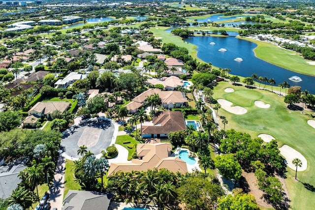 bird's eye view with a water view, view of golf course, and a residential view