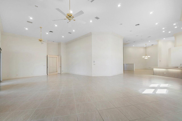 unfurnished room with a high ceiling, ornamental molding, visible vents, and ceiling fan with notable chandelier