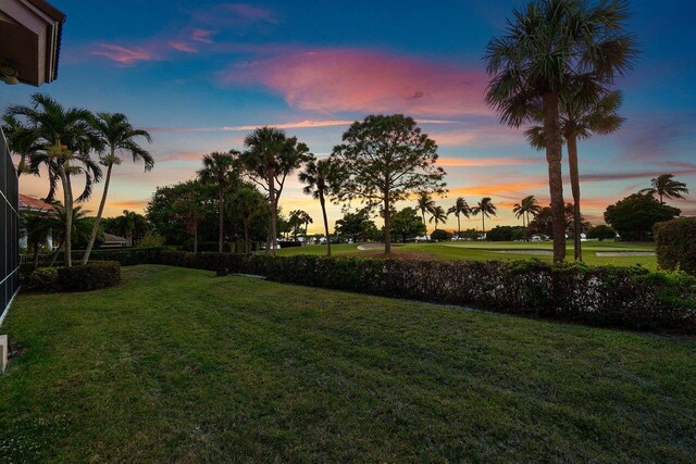view of yard at dusk