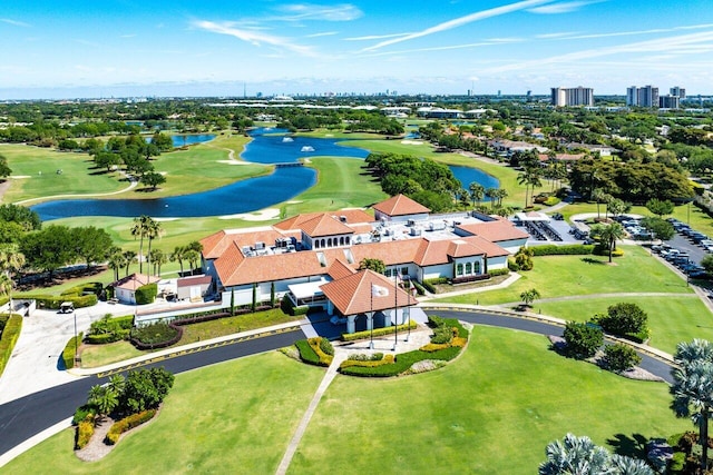 aerial view featuring a water view and view of golf course