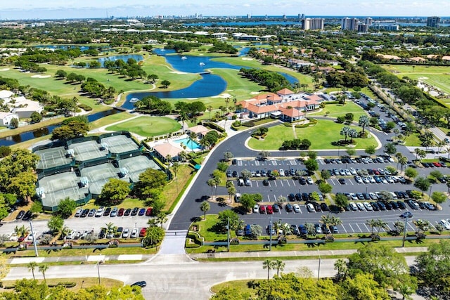 bird's eye view with view of golf course and a water view