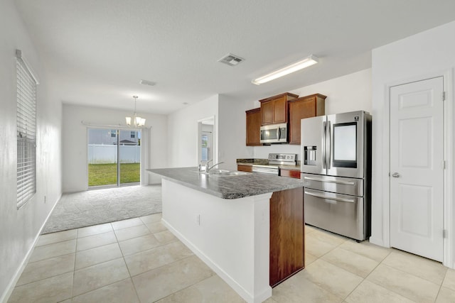 11265 SW Hadley St, Port Saint Lucie, FL 34987 - kitchen featuring a sink, light tile patterned floors, stainless steel appliances, a notable chandelier, and visible vents