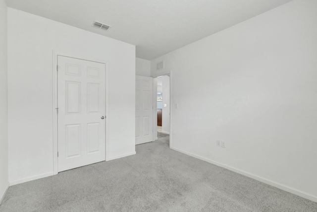 11265 SW Hadley St, Port Saint Lucie, FL 34987 - unfurnished bedroom featuring carpet floors, visible vents, and baseboards
