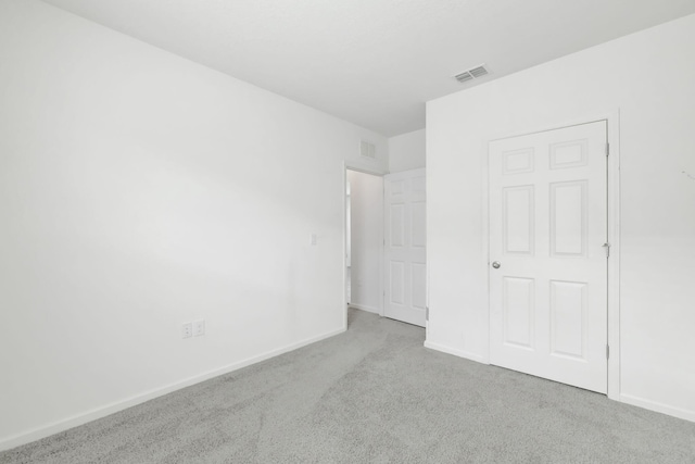 11265 SW Hadley St, Port Saint Lucie, FL 34987 - unfurnished bedroom featuring baseboards, visible vents, and carpet