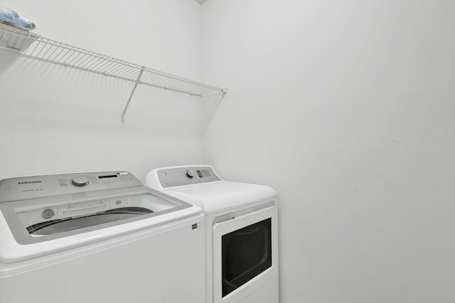 11265 SW Hadley St, Port Saint Lucie, FL 34987 - laundry area with laundry area and separate washer and dryer