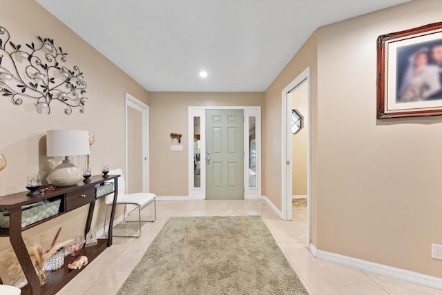 foyer entrance with light tile patterned floors, recessed lighting, and baseboards