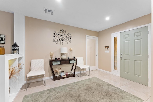 tiled foyer with visible vents, recessed lighting, and baseboards