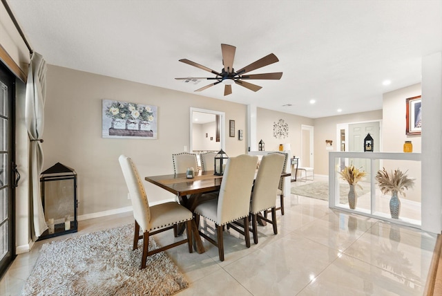 dining area with light tile patterned flooring, a ceiling fan, recessed lighting, and baseboards