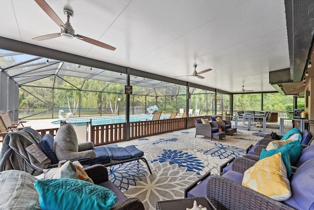 view of patio / terrace featuring an outdoor living space, ceiling fan, glass enclosure, and an outdoor pool