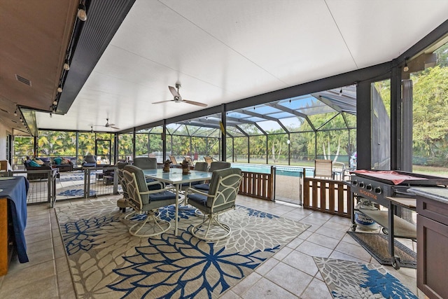 6028 140th Ave N, The Acreage, FL 33412 - sunroom / solarium with outdoor dining space and ceiling fan