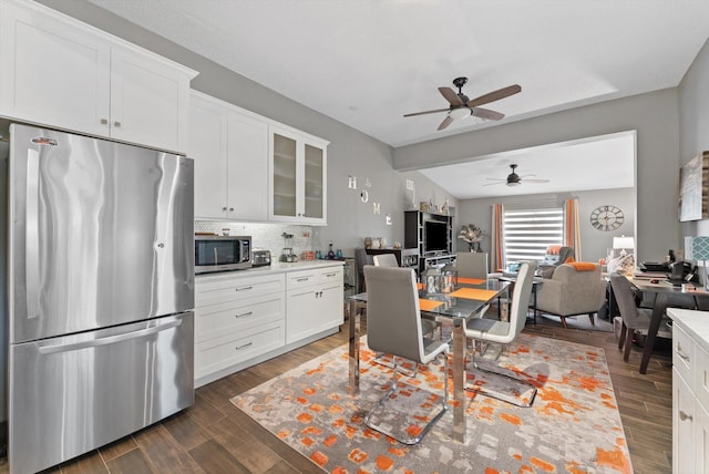 dining space featuring dark wood-style floors and a ceiling fan