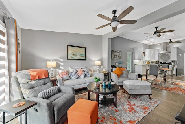 living room featuring ceiling fan and wood finished floors