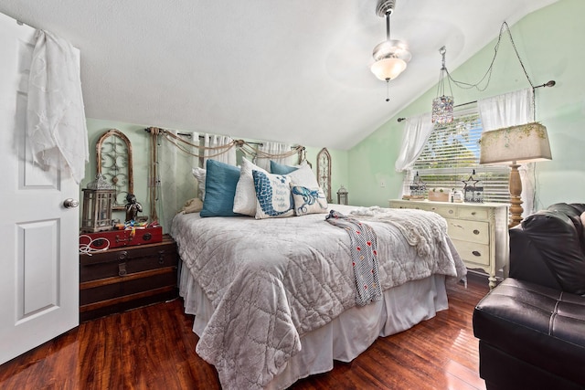 1894 NW Britt Rd, Stuart, FL 34994 - bedroom featuring wood finished floors, vaulted ceiling, and a ceiling fan