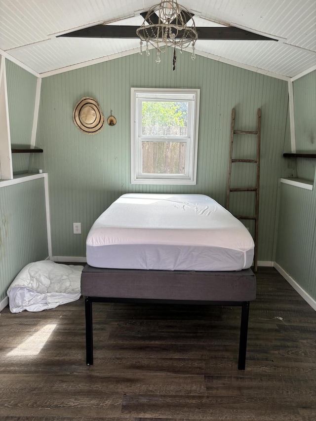 1894 NW Britt Rd, Stuart, FL 34994 - bedroom featuring wood finished floors, vaulted ceiling, baseboards, and a chandelier