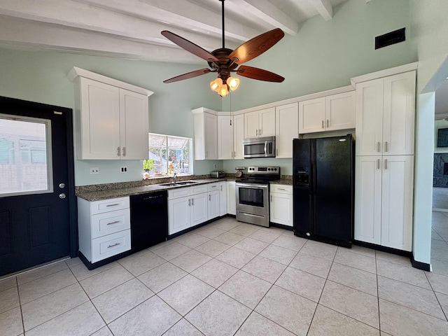 1894 NW Britt Rd, Stuart, FL 34994 - kitchen with black appliances, dark countertops, white cabinetry, light tile patterned floors, and ceiling fan