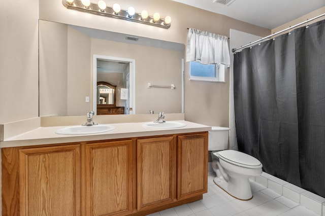 full bathroom featuring toilet, a sink, double vanity, and visible vents