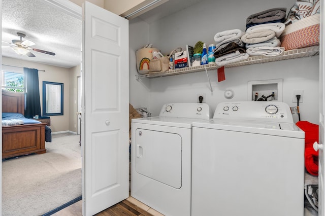 washroom with light colored carpet, a textured ceiling, ceiling fan, washer and dryer, and laundry area