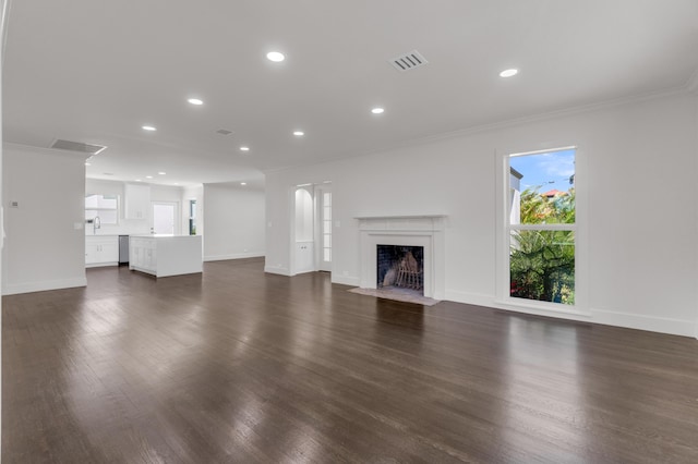 4015 Washington Rd, West Palm Beach, FL 33405 - unfurnished living room featuring dark wood-style flooring, baseboards, and a sink