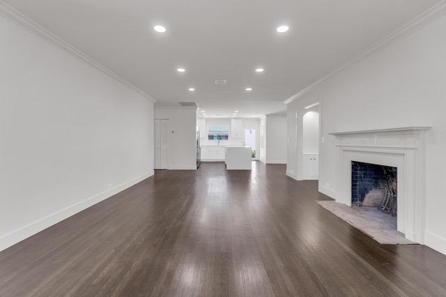 4015 Washington Rd, West Palm Beach, FL 33405 - unfurnished living room featuring dark wood-style flooring, baseboards, recessed lighting, crown molding, and a fireplace with flush hearth