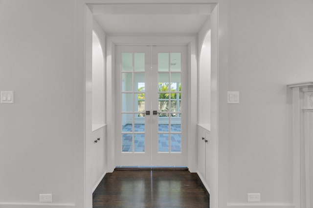 4015 Washington Rd, West Palm Beach, FL 33405 - entryway featuring french doors, arched walkways, and dark wood-style floors