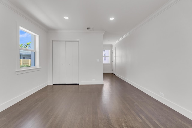 4015 Washington Rd, West Palm Beach, FL 33405 - unfurnished bedroom with dark wood-style flooring, baseboards, ornamental molding, and visible vents