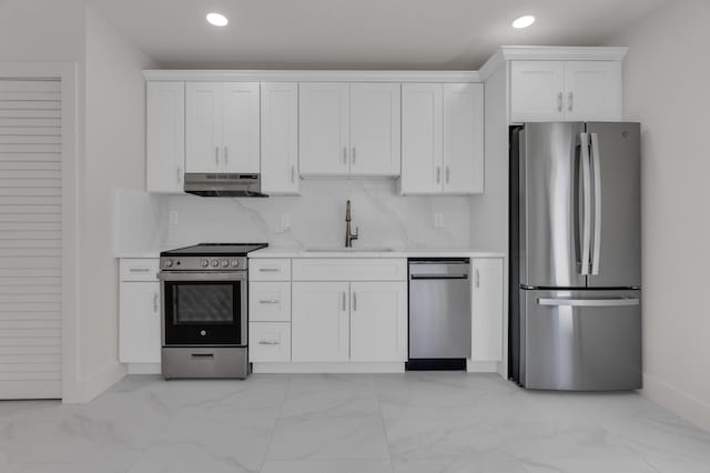 4015 Washington Rd, West Palm Beach, FL 33405 - kitchen with stainless steel appliances, under cabinet range hood, marble finish floor, and a sink
