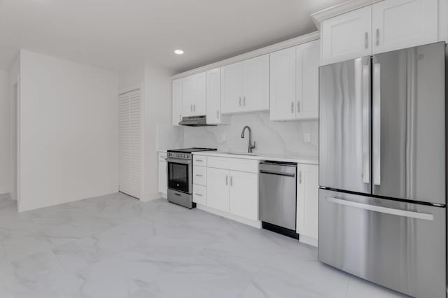 4015 Washington Rd, West Palm Beach, FL 33405 - kitchen featuring white cabinets, a sink, light countertops, appliances with stainless steel finishes, and under cabinet range hood