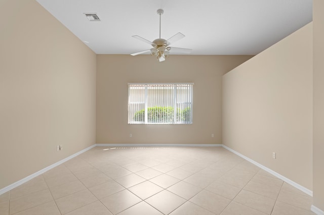 unfurnished room featuring baseboards, visible vents, ceiling fan, and light tile patterned floors