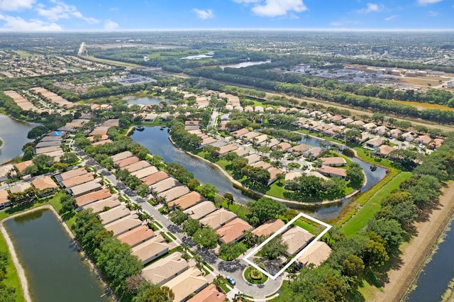 birds eye view of property with a residential view and a water view