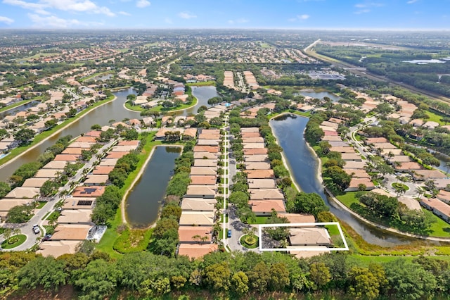 aerial view with a residential view and a water view