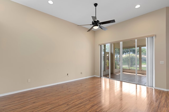 spare room featuring recessed lighting, baseboards, ceiling fan, and wood finished floors