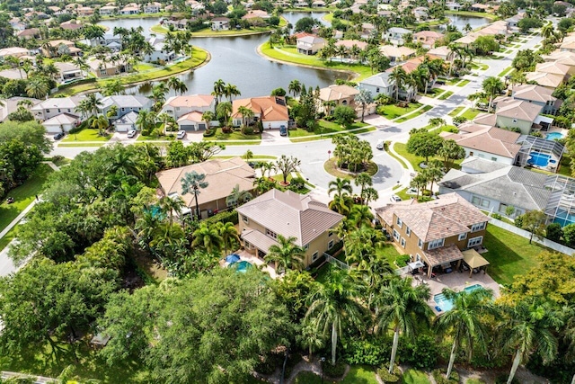 birds eye view of property with a water view and a residential view