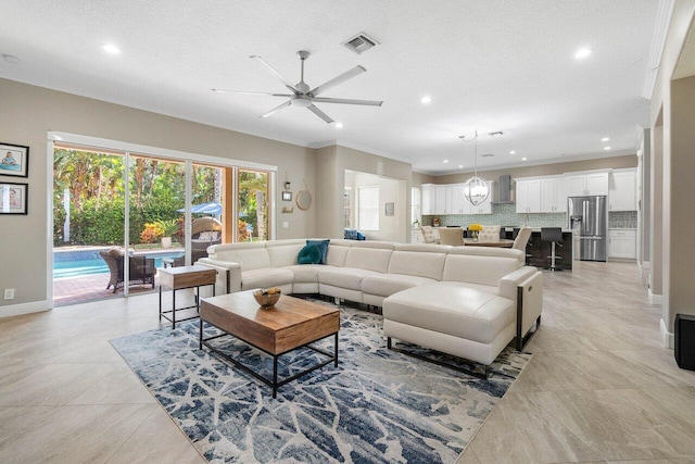 living area featuring crown molding, ceiling fan, baseboards, visible vents, and recessed lighting