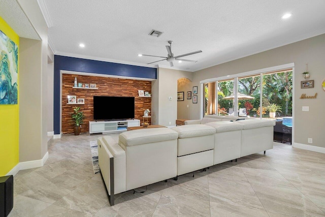 living room featuring a textured ceiling, ceiling fan, baseboards, visible vents, and recessed lighting