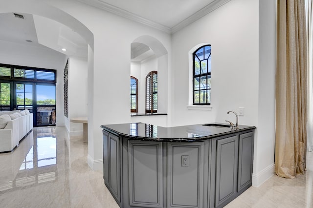9210 Equus Cir, Boynton Beach, FL 33472 - bar with plenty of natural light, a sink, light marble finish flooring, and ornamental molding