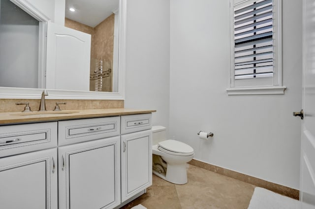 9210 Equus Cir, Boynton Beach, FL 33472 - full bath with vanity, toilet, tile patterned floors, baseboards, and a shower